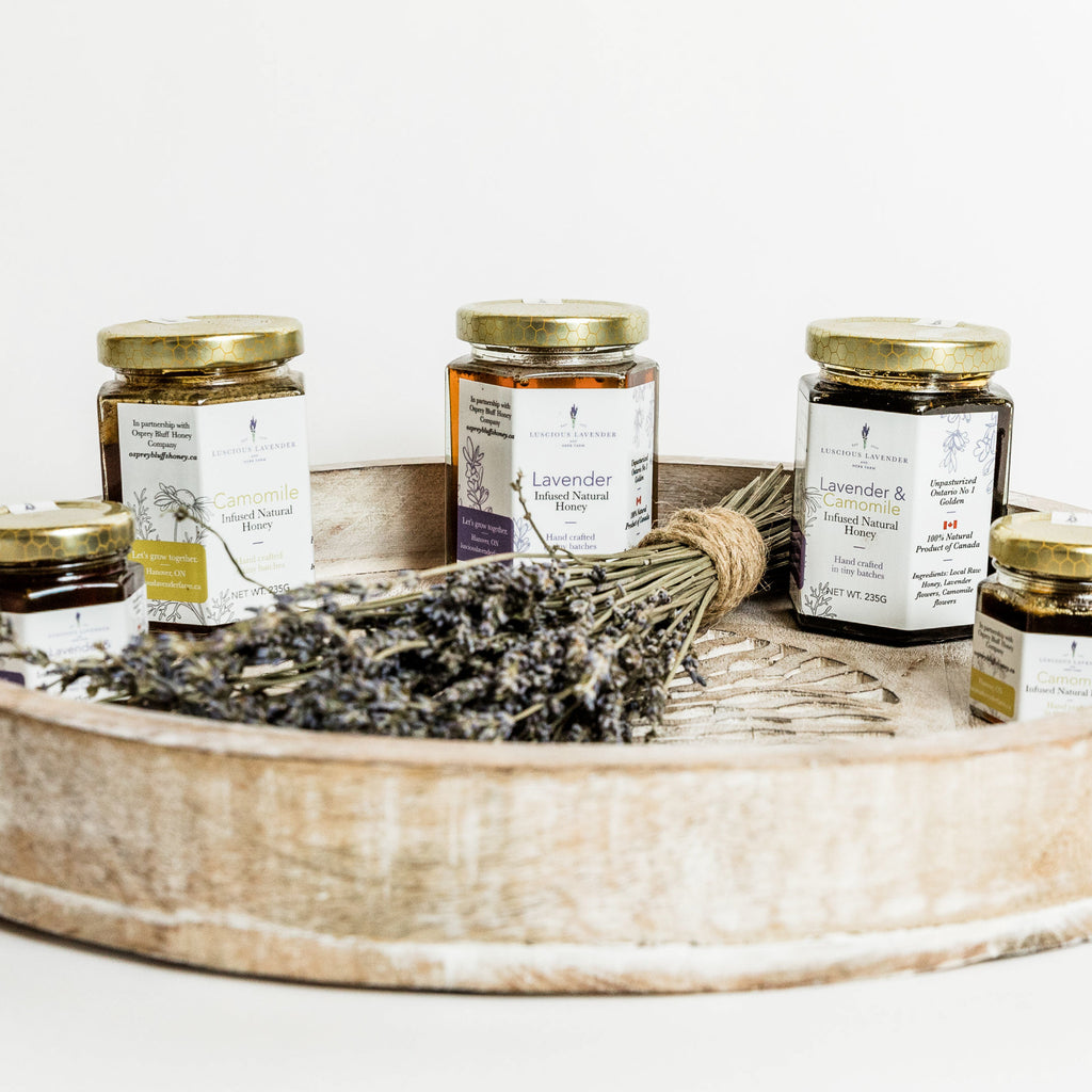 honey in a wooden tray with dried lavender