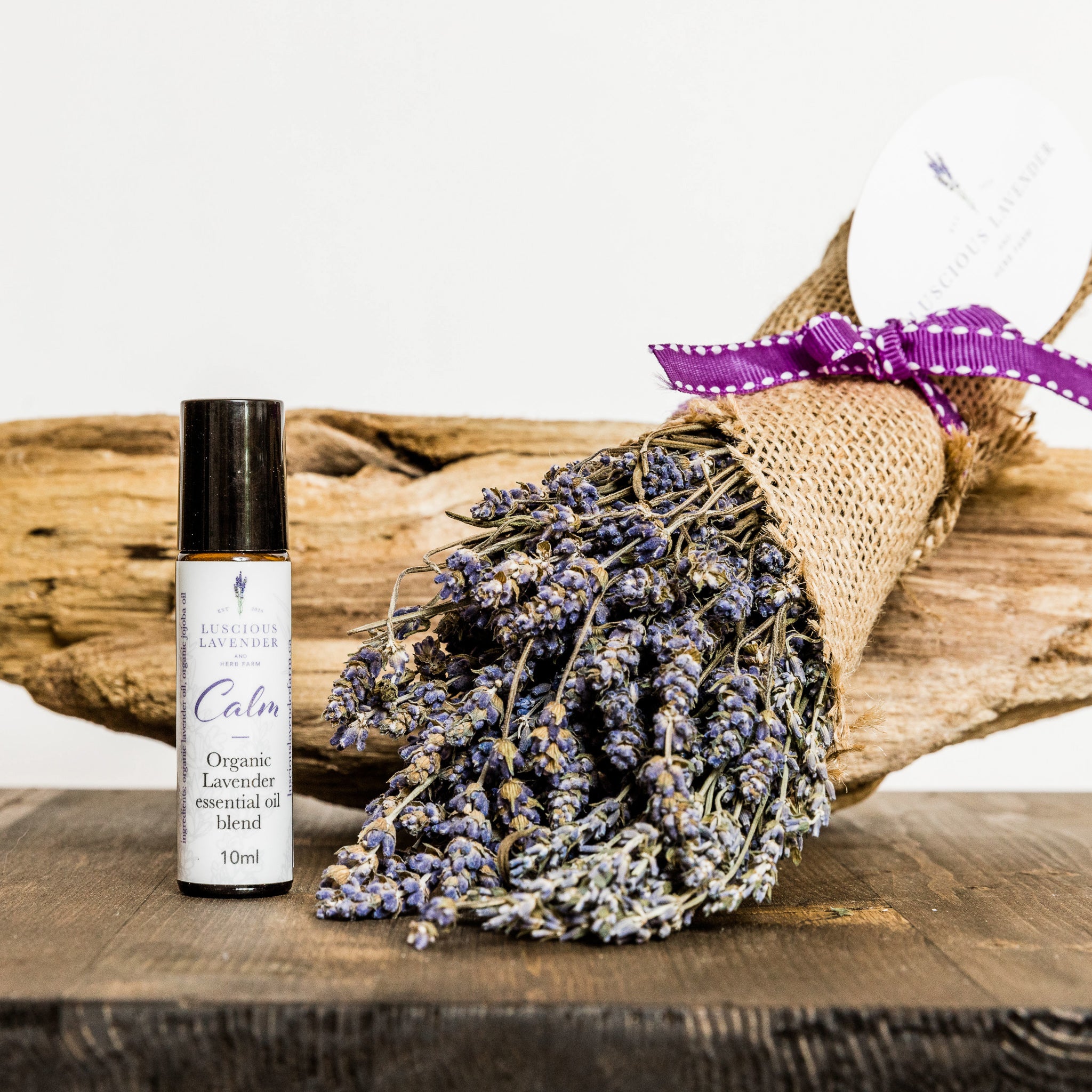 Calm lavender rollerball next to a bunch of dried lavender